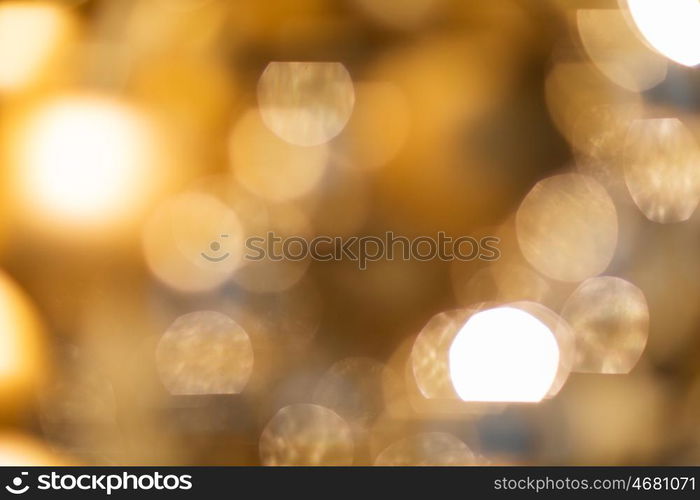 holidays, luxury and background concept - blurred golden christmas lights bokeh