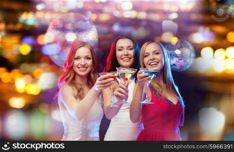 holidays, nightlife, bachelorette party and people concept - smiling women with cocktails at night club