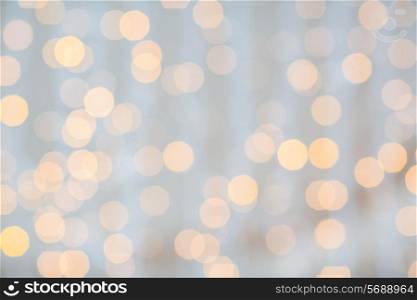 holidays, party and celebration concept - blurred glden lights background