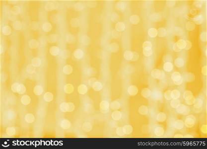 holidays, party and celebration concept - blurred golden background with bokeh lights