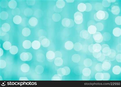 holidays, party and celebration concept - blurred green blue background with bokeh lights