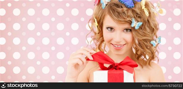 holidays, people and happiness concept - smiling young woman with flowers over pink and white polka dots pattern background