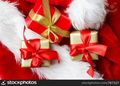 Holidays, present, christmas concept. Small boxes with gifts tied bows on red background