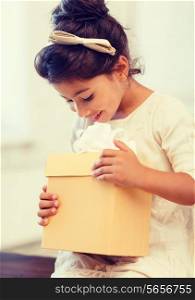holidays, presents, christmas, birthday concept - happy child girl with gift box