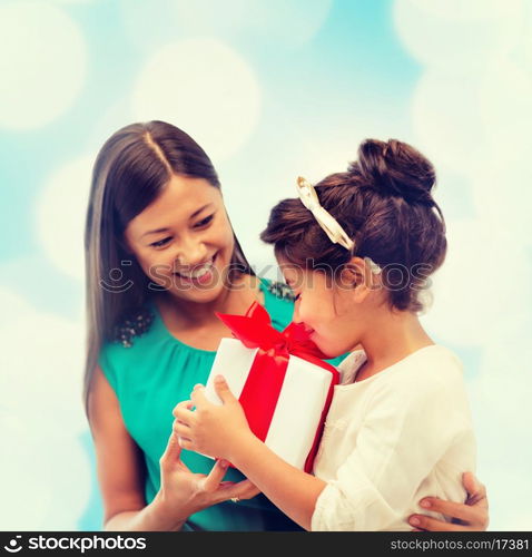 holidays, presents, christmas, birthday concept - happy mother and child girl with gift box