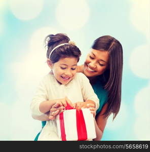 holidays, presents, christmas, birthday concept - happy mother and child girl with gift box