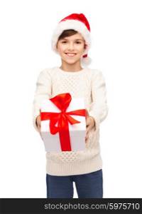 holidays, presents, christmas, childhood and people concept - smiling happy boy in santa hat with gift box