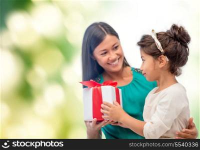 holidays, presents, christmas, family, child and x-mas, birthday concept - happy mother and child girl with gift box