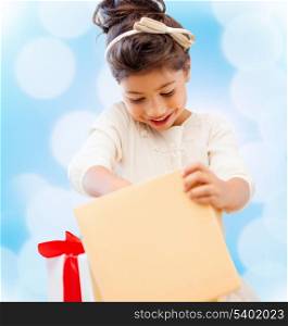holidays, presents, christmas, x-mas, birthday concept - happy child girl with gift box