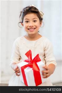 holidays, presents, christmas, x-mas, birthday concept - happy child girl with gift box