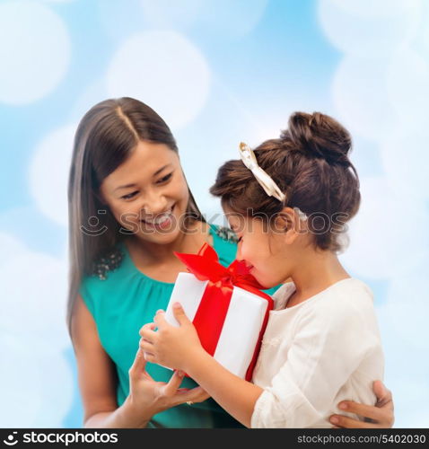 holidays, presents, christmas, x-mas, birthday concept - happy mother and child girl with gift box