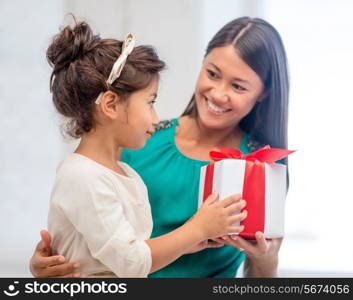 holidays, presents, christmas, x-mas, birthday concept - happy mother and child girl with gift box