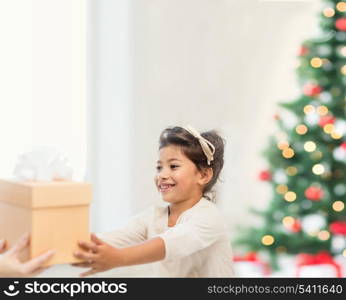 holidays, presents, christmas, x-mas concept - happy child girl with gift box