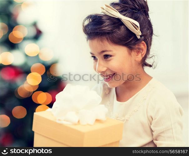 holidays, presents, christmas, x-mas concept - happy child girl with gift box