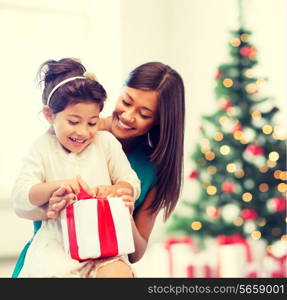 holidays, presents, christmas, x-mas concept - happy mother and child girl with gift box