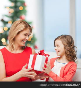 holidays, presents, christmas, x-mas concept - happy mother and child girl with gift box