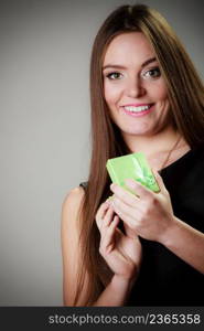 Holidays, presents, love and happiness concept. Beautiful young woman holding an open jewelery green gift for anniversary