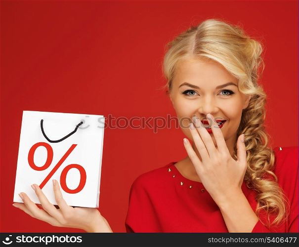 holidays, sale, christmas and shopping concept - woman holding bag with percent sign
