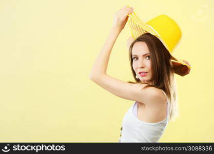 Holidays summer fashion and head protection. Woman in big yellow hat. Portrait of charming female on bright background.