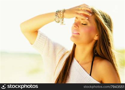 Holidays, vacation happiness and beauty concept. Portrait of lovely girl long brown hair enjoying sunlight on warm sunny day outdoor