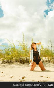 Holidays, vacation travel and freedom concept. Beautiful sexy girl on beach. Young pretty woman relaxing on the sea coast.