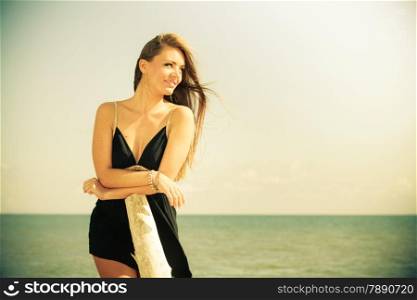 Holidays, vacation travel and freedom concept. Portrait of attractive sensual girl beauty long hair on seaside. Young pretty tanned woman in summer dress relaxing on the sea coast