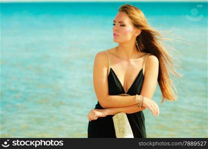 Holidays, vacation travel and freedom concept. Portrait of lovely girl beauty long hair on seaside. Young pretty tanned woman in summer clothing on blue water background