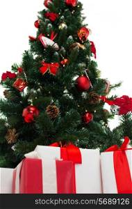 holidays, winter and celebration concept - close up of christmas tree and presents