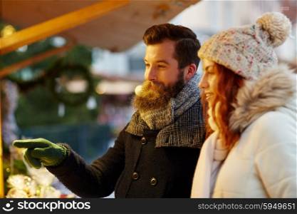 holidays, winter, christmas and people concept - happy couple in warm clothes outdoors