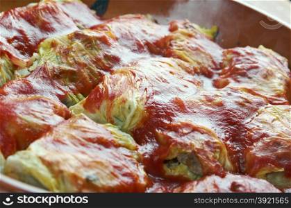 Holishkes - traditional Jewish cabbage roll dish.cabbage leaves wrapped in parcel-like manner around minced meat and tomato sauce