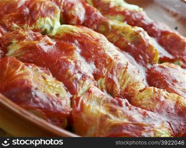 Holishkes - traditional Jewish cabbage roll dish.cabbage leaves wrapped in parcel-like manner around minced meat and tomato sauce