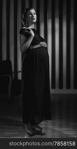 Hollywood black and white, a beautiful pregnant woman - minimal lighting and strong contrast