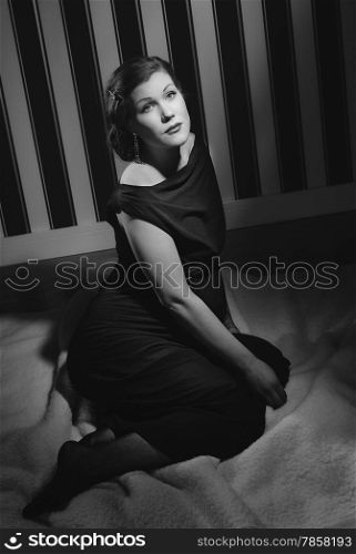 Hollywood black and white, a beautiful pregnant woman - minimal lighting and strong contrast