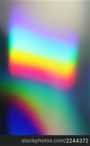 Holographic real texture in blue pink green colors with scratches and irregularities. Holographic rainbow foil abstract background.. Holographic real texture in blue pink green colors with scratches and irregularities. Holographic color wrinkled foil.