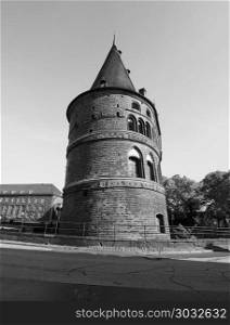 Holstentor (Holsten Gate) in Luebeck bw. Holstentor (previously Holstein Tor, meaning Holsten Gate) in Luebeck, Germany in black and white