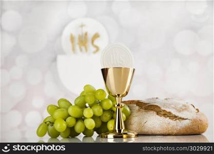 Holy communion a golden chalice, composition isolated on white. Holy communion elements on white background