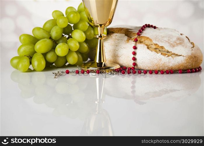 Holy communion a golden chalice, composition isolated on white. Holy communion elements on white background