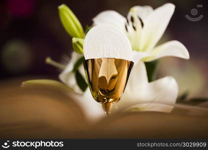 Holy communion a golden chalice with grapes and bread wafers. Sacrament of communion, Eucharist symbol