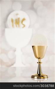 Holy communion for christianity religion, elements on white back. Holy communion a golden chalice, composition isolated on white