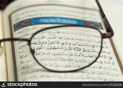 Holy Quran and glasses macro