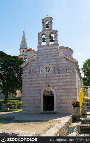 Holy Trinity church in old town in Budva in a beautiful summer day, Montenegro