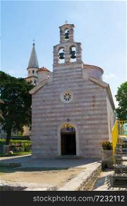 Holy Trinity church in old town in Budva in a beautiful summer day, Montenegro