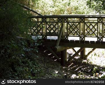 Holzbruecke im Park. Wooden bridge in the park Glienicke, Berlin, Germany