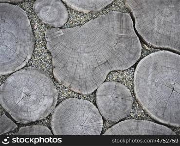 Holzscheiben. gray floor wooden discs and sand