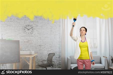 Home and house renovation mixed media. Woman with a painting roller or brush in renovate interior