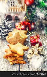 Home-baked star-shaped Christmas decorations on wooden background. Christmas cookies handmade