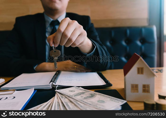 Home buying broker holding the key.