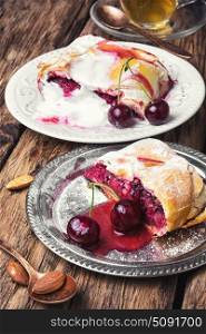 Home cherry strudel. Traditional puff pastry strudel with berries of cherry