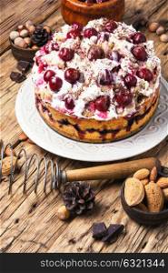 home cream pie with cherry in a rustic style. Homemade cherry cake