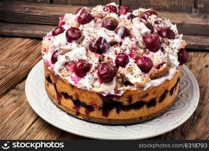 home cream pie with cherry in a rustic style. pie with cherry